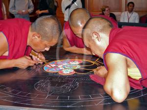 3 Tibetan Monks starting the Sand Mandala Day 1