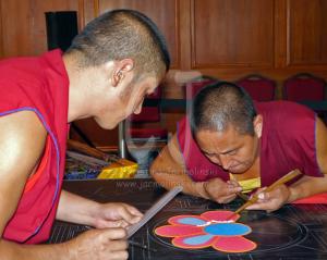 Two Tibetan Monks starting the Sand Mandala Day 1