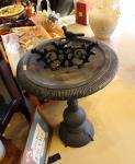 Bird bath in antique store at the river by Christina Jarmolinski