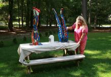 Christina in the Yard using Resin to secure the Legs