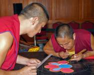 Two Tibetan Monks starting the Sand Mandala Day 1