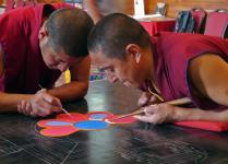 Two Tibetan Monks starting the Sand Mandala Day 1