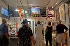 Collectors viewing Christina's newest paintings in Syzygy Gallery