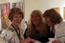 three artists discussing the show