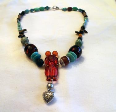 A-couple-sharing-their-love-necklace-2-private-collection